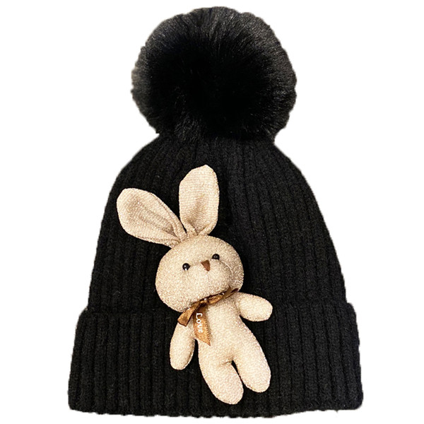 Kötött női sapka tollal és kiegészítővel