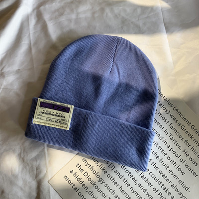 Γυναικείο ελαστικό καπέλο με έμβλημα