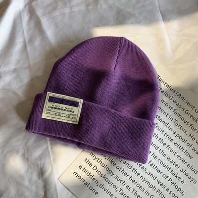 Γυναικείο ελαστικό καπέλο με έμβλημα