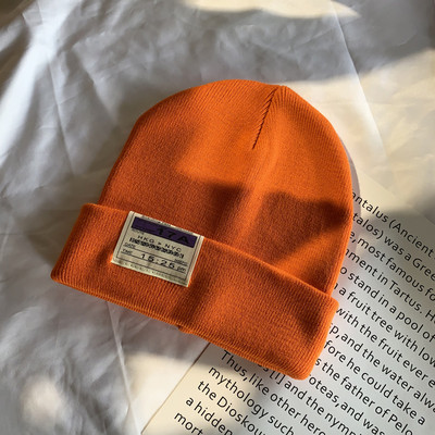 Γυναικείο ελαστικό καπέλο με έμβλημα