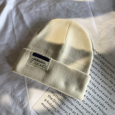 Γυναικείο ελαστικό καπέλο με έμβλημα