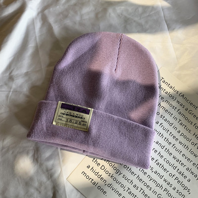 Γυναικείο ελαστικό καπέλο με έμβλημα