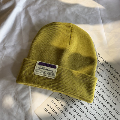 Γυναικείο ελαστικό καπέλο με έμβλημα