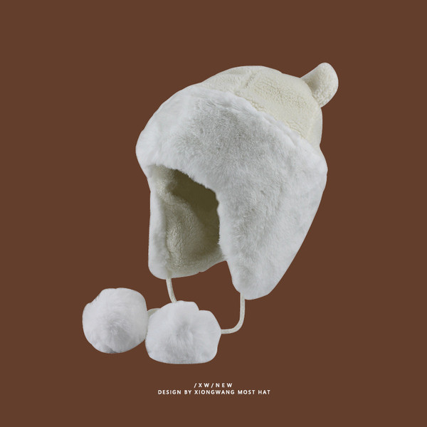 Téli meleg sapka típusú fülvédő pomponokkal