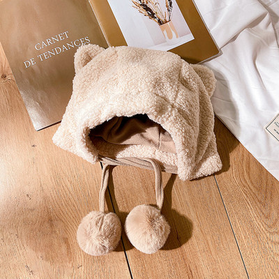 Új modell női sapka füles, pehelypomponokkal