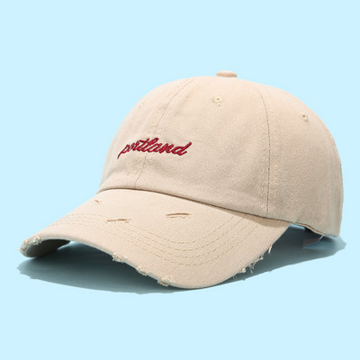 Textil sapka napellenzővel, szakadt motívumokkal