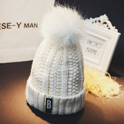 Πλεκτό χειμερινό καπέλο με φούντα