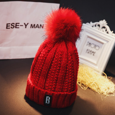 Πλεκτό χειμερινό καπέλο με φούντα