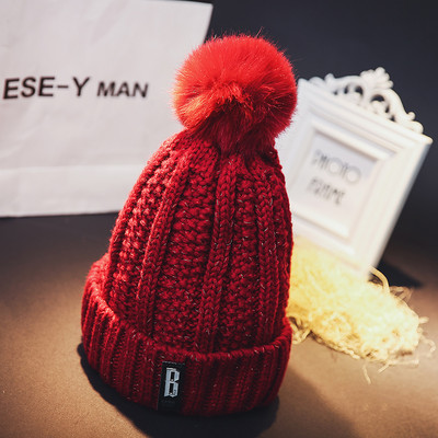 Πλεκτό χειμερινό καπέλο με φούντα