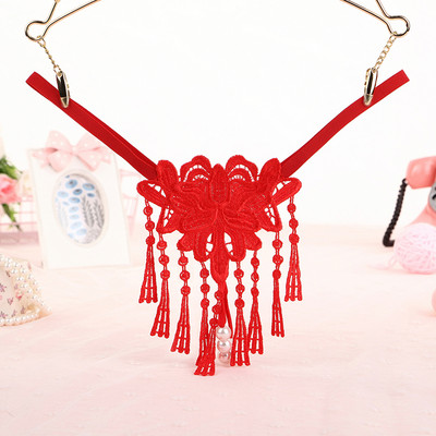 Női tanga rojtokkal és hímzéssel