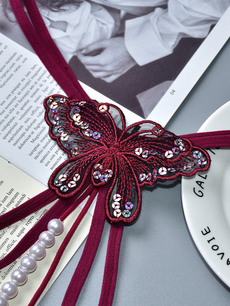 Női tangák új modellje pillangóval és gyöngyökkel