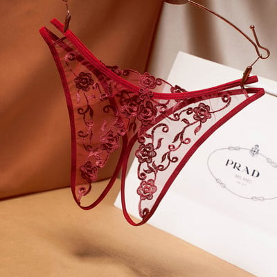 Modern women`s thongs with cut-out part and embroidery