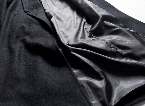 Modern női hosszú kabát fekete zsebekkel