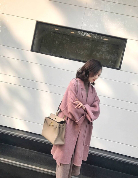 Korszerű női kabát rögzítés nélkül 2XL méretig