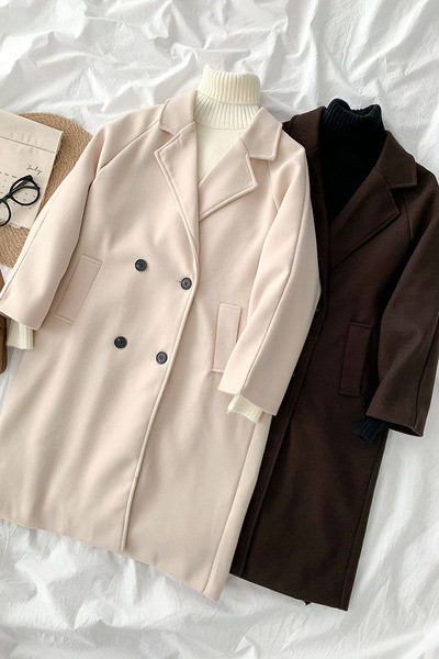 Új modell női hosszú kabát gombokkal és zsebekkel