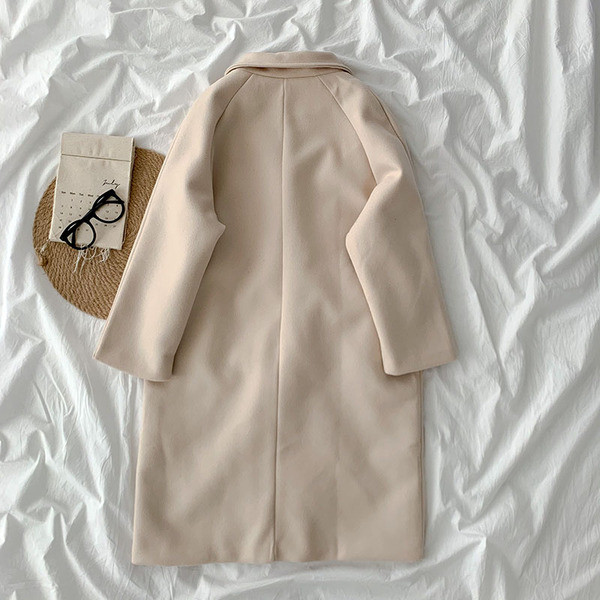 Új modell női hosszú kabát gombokkal és zsebekkel