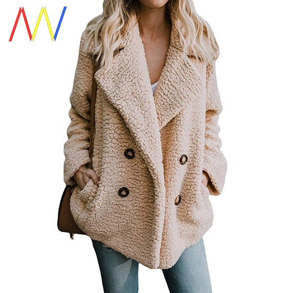 Széles kabát kétsoros rögzítéssel és zsebekkel