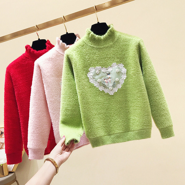 Modern gyerekpulóver lányoknak magas gallérral és rátéttel