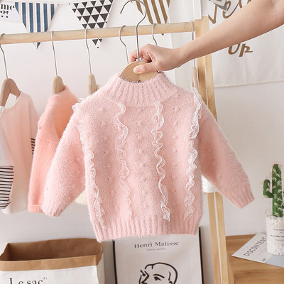 Modern gyerekpulóver lányoknak magas gallérral és tülllel