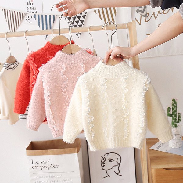 Modern gyerekpulóver lányoknak magas gallérral és tülllel