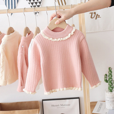 Alkalmi gyerekpulóver magas gallérral és fürtökkel, lányok számára