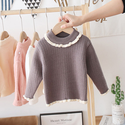 Alkalmi gyerekpulóver magas gallérral és fürtökkel, lányok számára