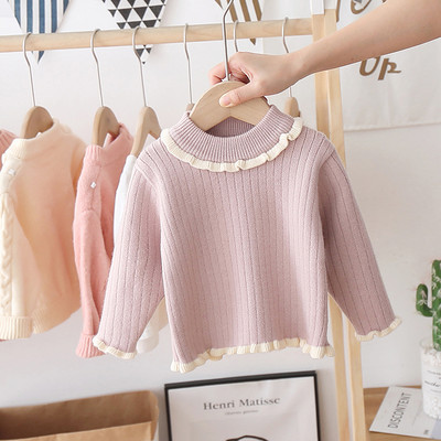 Alkalmi gyerekpulóver magas gallérral és fürtökkel, lányok számára