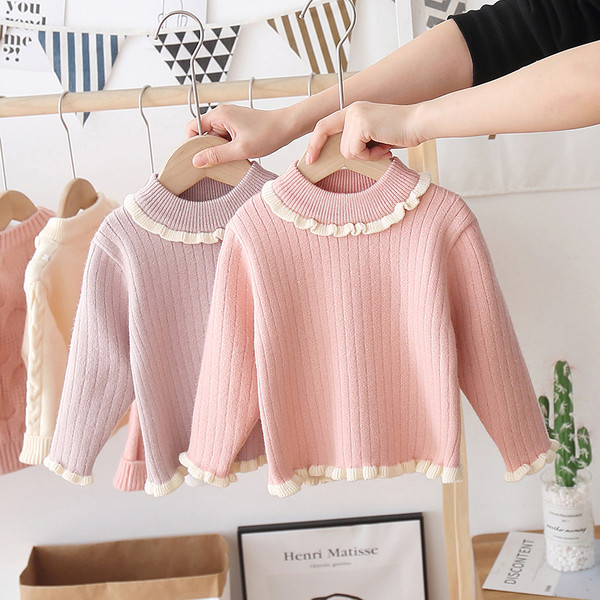 Alkalmi gyerekpulóver magas gallérral és fürtökkel, lányok számára