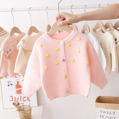 Alkalmi gyerekmellény lányoknak ovális gallérral és színes gombokkal