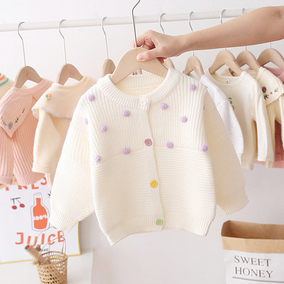 Alkalmi gyerekmellény lányoknak ovális gallérral és színes gombokkal