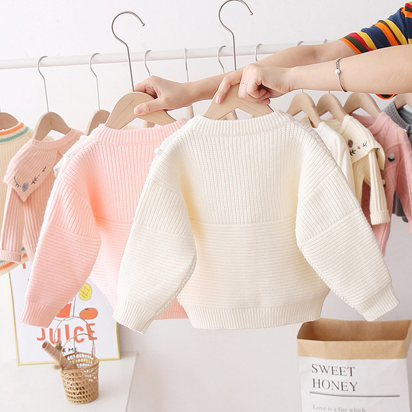 Alkalmi gyerekmellény lányoknak ovális gallérral és színes gombokkal