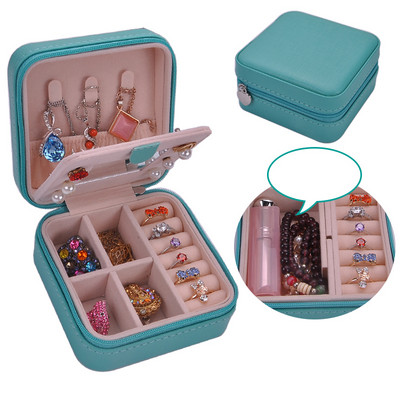 Juvelierizstrādājumu kastīte ar rāvējslēdzēju un nodalījumu gredzeniem un auskariem