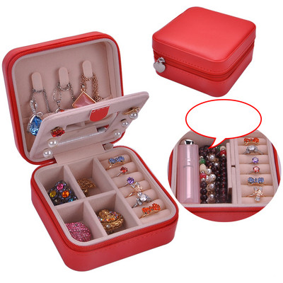 Juvelierizstrādājumu kastīte ar rāvējslēdzēju un nodalījumu gredzeniem un auskariem