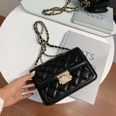 Актуална дамска чанта от еко кожа с метална дръжка и закопчаване