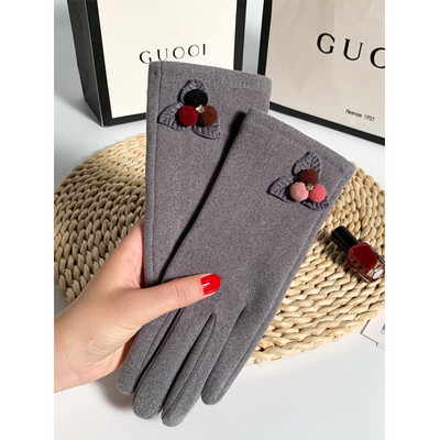 Ženske vunene rukavice s perom