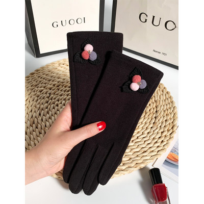 Ženske vunene rukavice s perom