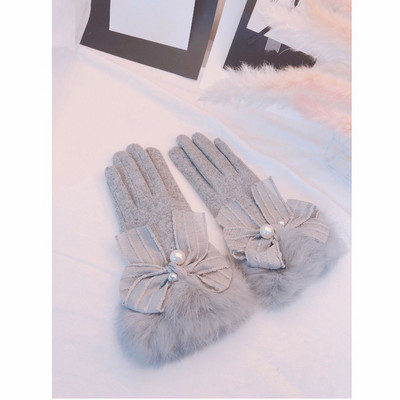 Elegant women`s winter gloves with ribbons and pearls
