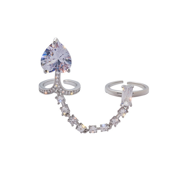 Stílusos női gyűrű lánccal és kövekkel