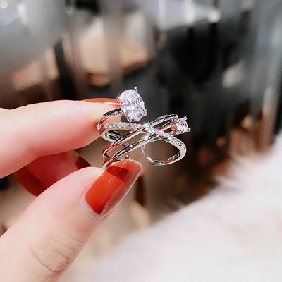 Elegant women`s ring with decorative stones