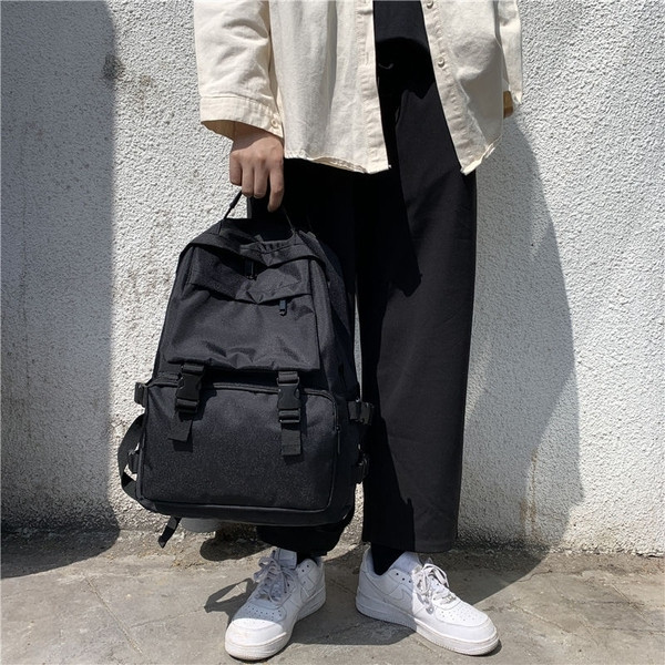 Uniszex textil hátizsák sok zsebbel