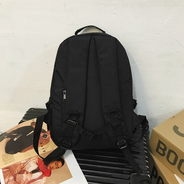 Uniszex textil hátizsák sok zsebbel