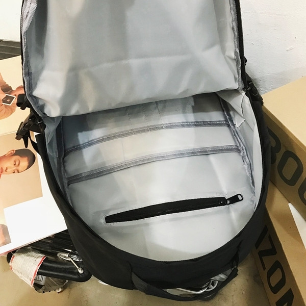 Uniszex textil hátizsák sok zsebbel