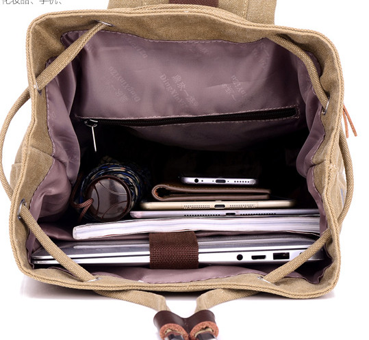 Tekstiilist meeste seljakott kirjadega