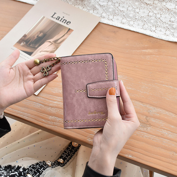 Naiste rahakott ökonahast metallelemendiga