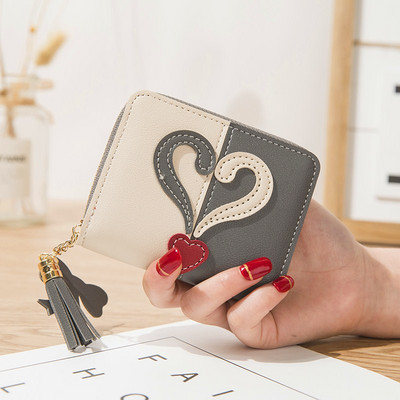 Μικρό γυναικείο πορτοφόλι με φερμουάρ και φούντα