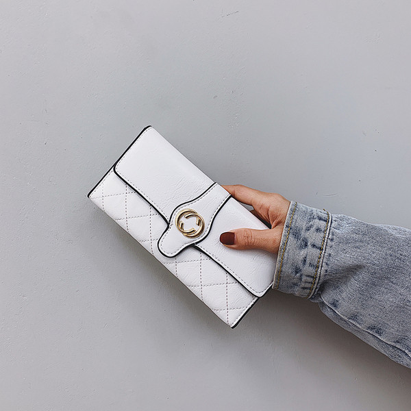 Naiste rahakott ökonahast metallist kaunistusega mitmes värvitoonis