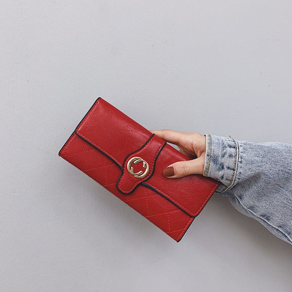 Naiste rahakott ökonahast metallist kaunistusega mitmes värvitoonis