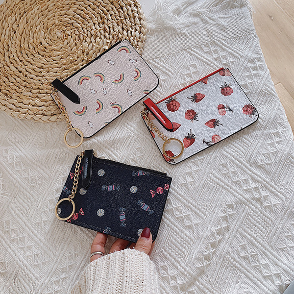 Mitmes värvitoonis metallist keti ja lukuga naiste rahakott