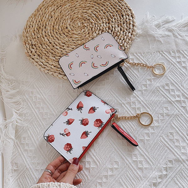 Mitmes värvitoonis metallist keti ja lukuga naiste rahakott