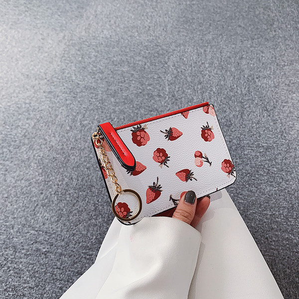 Mitmes värvitoonis metallist keti ja lukuga naiste rahakott